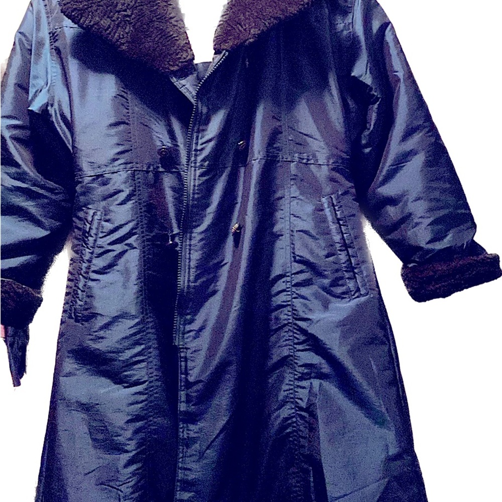 Navy blue. Fleece collar and cuffs. One loose button on front but can be sewn.